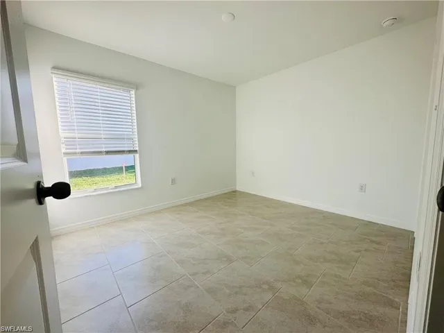 Empty room with baseboards