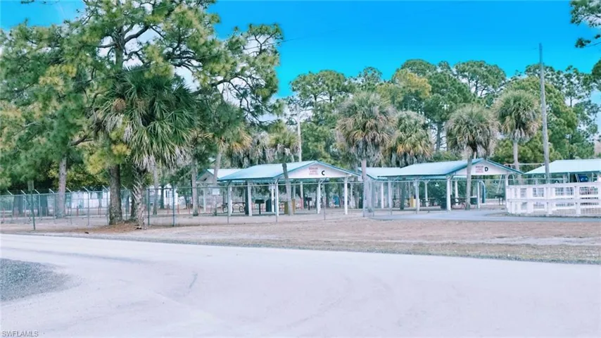 Surrounding community with view of wooded area