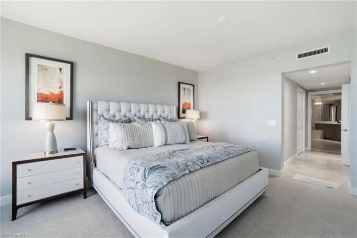 Carpeted bedroom with baseboards