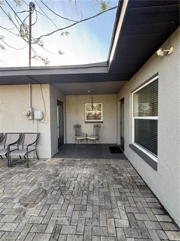 View of yard with fence and a patio