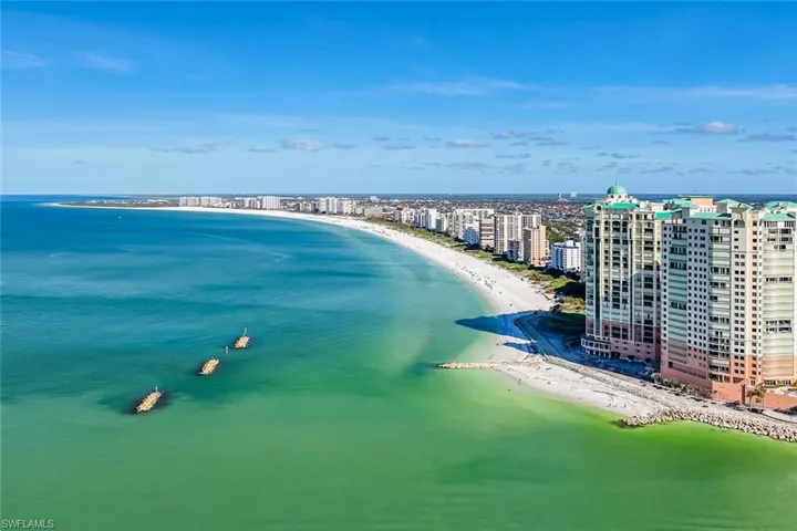 Coastal beachfront property with direct access to a wide sandy beach