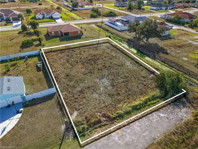 Aerial view of residential area with property boundaries highlighted