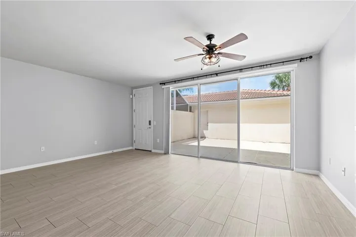 28462 Villagewalk Blvd Bonita Springs FL 34135 - Living room with slider access to patio