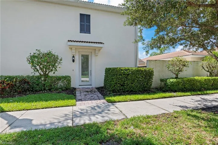 28462 Villagewalk Blvd Bonita Springs FL 34135 - Primary entry door with glass panel creates lots of light inside