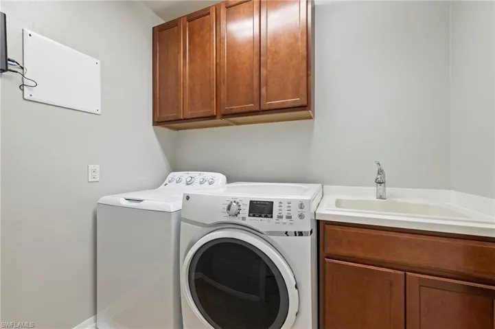 28462 Villagewalk Blvd Bonita Springs FL 34135 - Second floor laundry room with utility sink