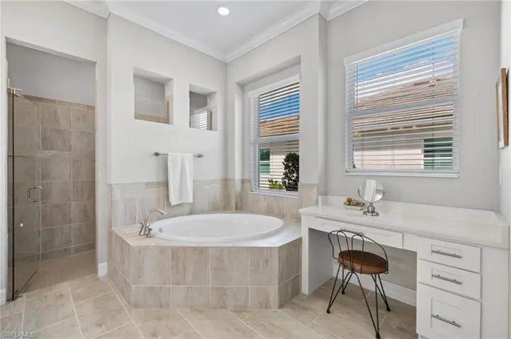 Spa like primary bathroom, double sinks, soaker tub and dual head walk in shower
