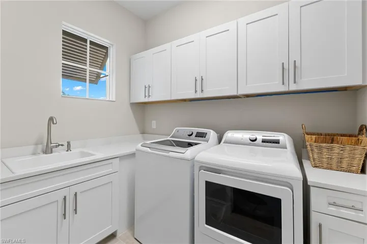 Dedicated laundry with tons of storage and a window