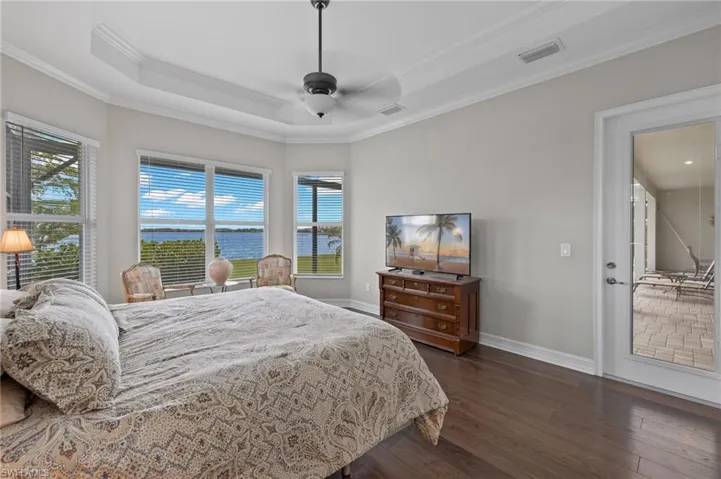 Primary bedroom with water views and door to lanai