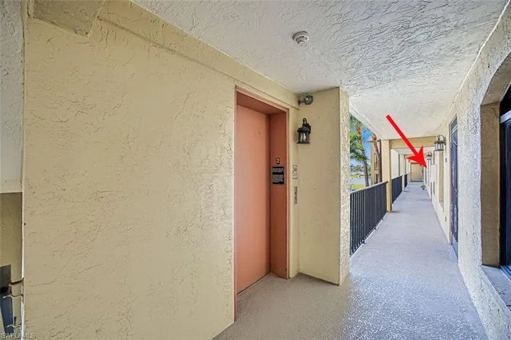 Hallway featuring elevator