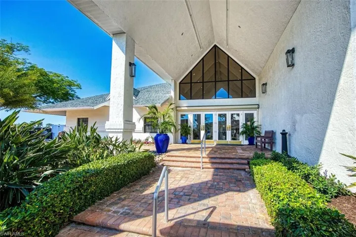 Property entrance featuring french doors