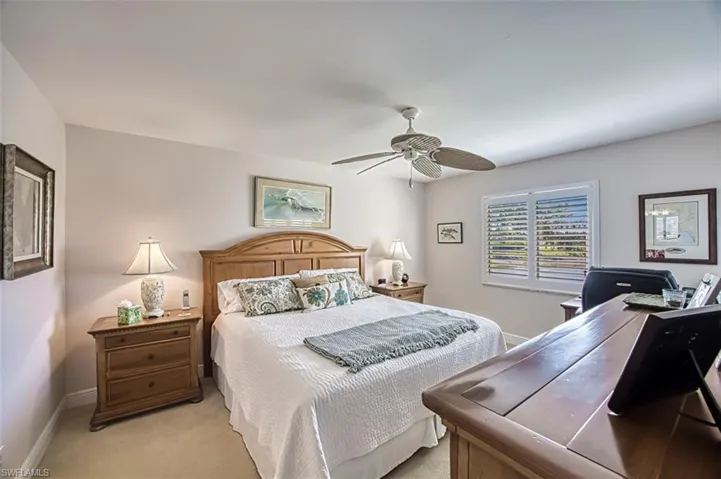 Bedroom featuring ceiling fan and light carpet