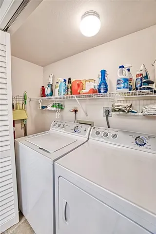 Laundry area featuring separate washer and dryer