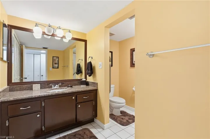 Bathroom featuring vanity and light tile patterned flooring