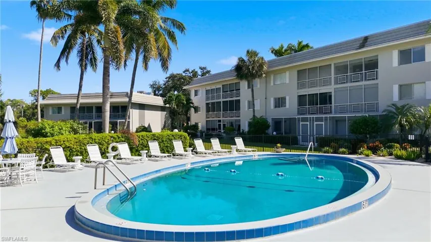 Community pool with a patio area