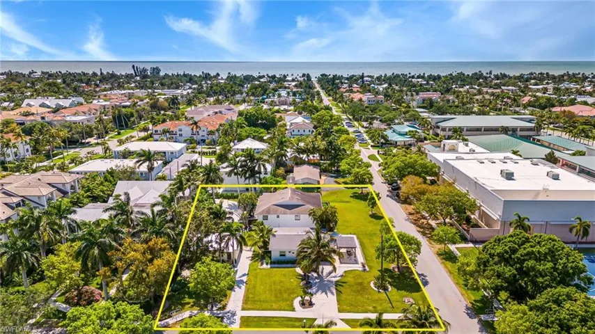 Aerial view of residential area featuring property boundaries highlighted