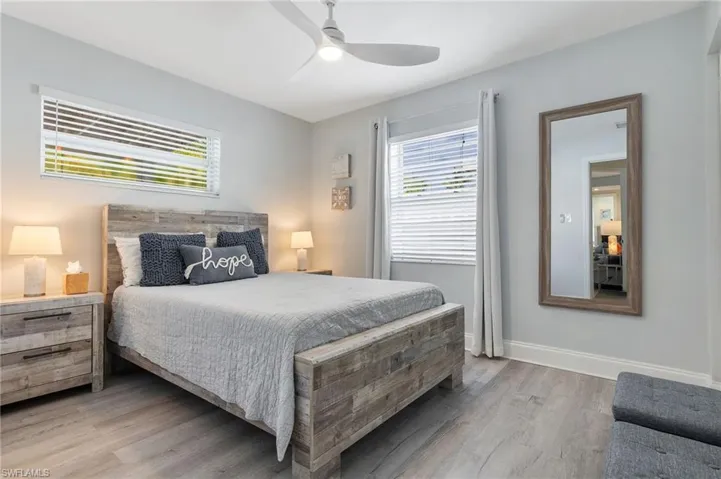 Bedroom with light wood-style floors and ceiling fan