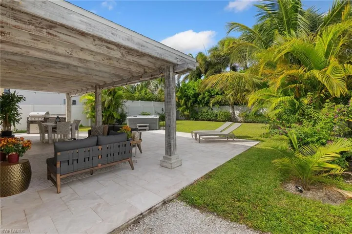 Fenced backyard featuring an outdoor living space, a patio area, and outdoor dining area
