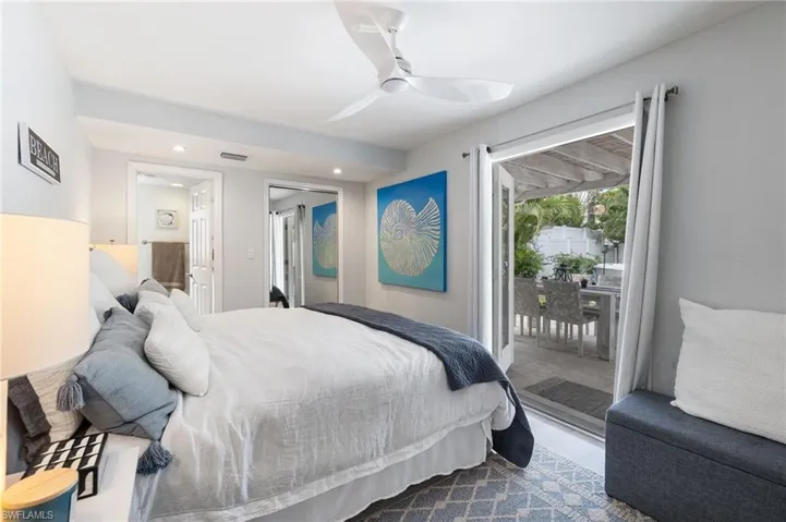 Bedroom featuring access to outside, a ceiling fan, and recessed lighting
