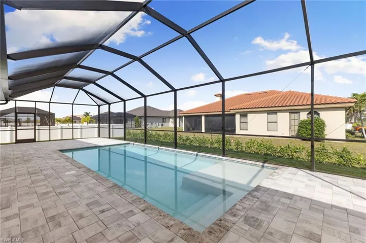 Pool with sunshelf and accented with beautfiul pavers