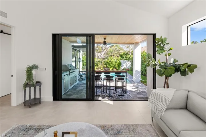 Doorway featuring lofted ceiling