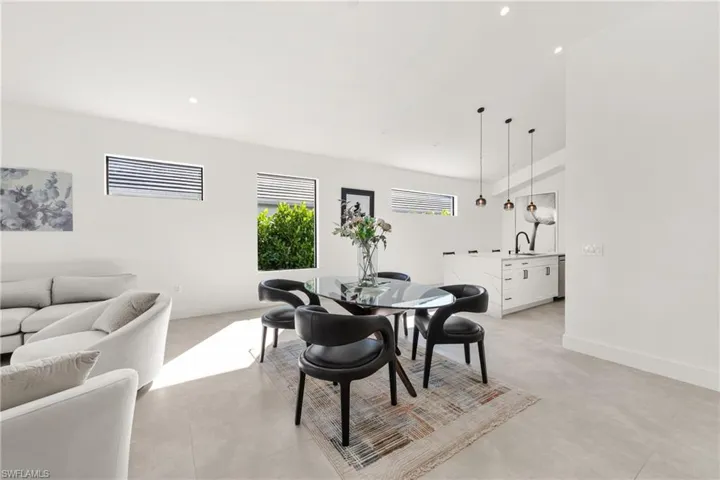 Dining area featuring baseboards and recessed lighting