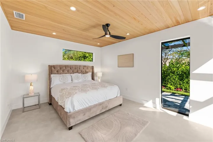 Bedroom featuring wooden ceiling, baseboards, visible vents, and recessed lighting