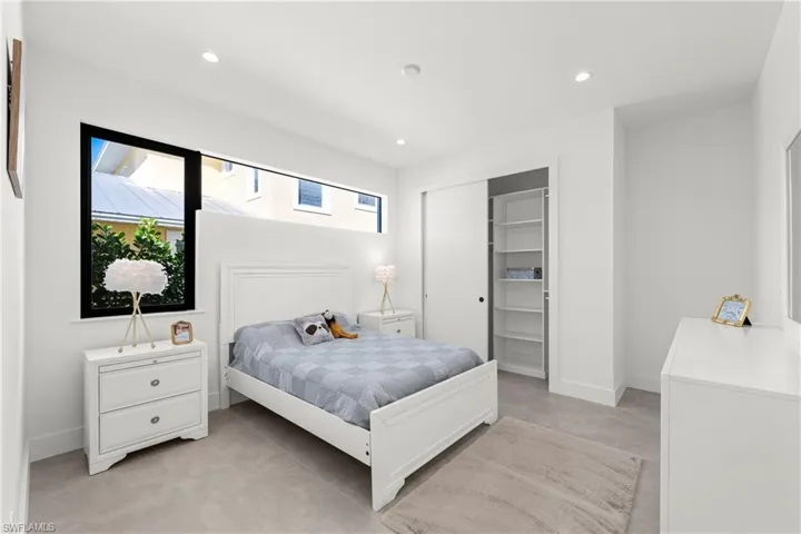 Bedroom with recessed lighting, a closet, and baseboards
