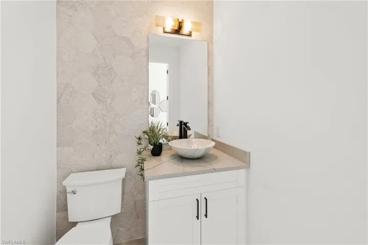 Bathroom featuring toilet and vanity