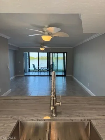 Dining and Living area from kitchen to lanai/bay view Currently not furnished