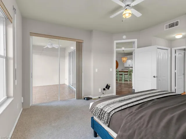 This photo includes reality staging to show the potential of the primary bedroom.