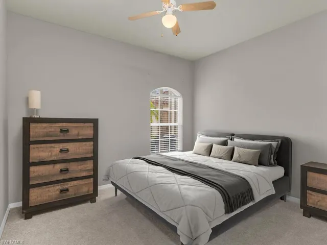 This photo includes reality staging to show the potential of the guest bedroom.