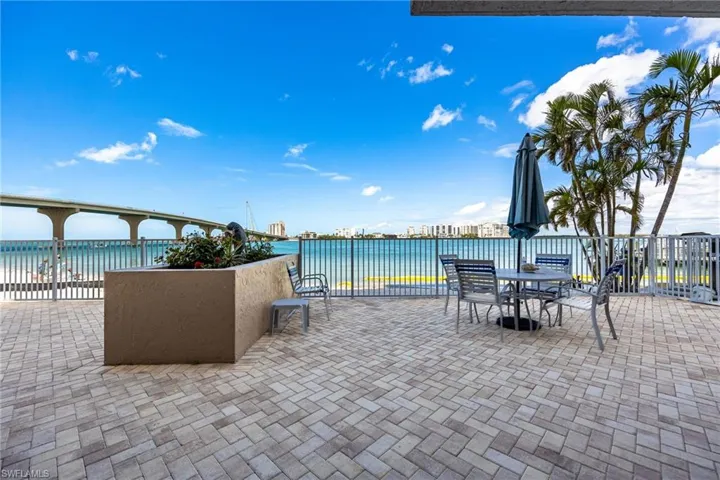 Waterfront patio with seating and relaxation areas
