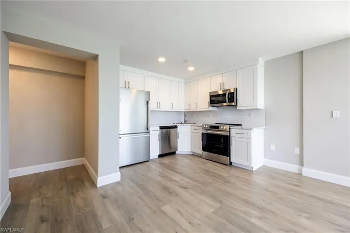 Open-concept layout connecting kitchen and living space
