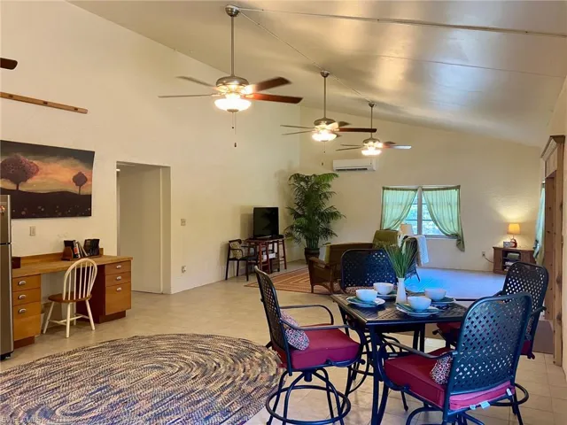 Open concept Living/Dining/Kitchen with soaring ceilings and plenty of room to spread out.  Tile throughout. This home stays very cool and comfortable