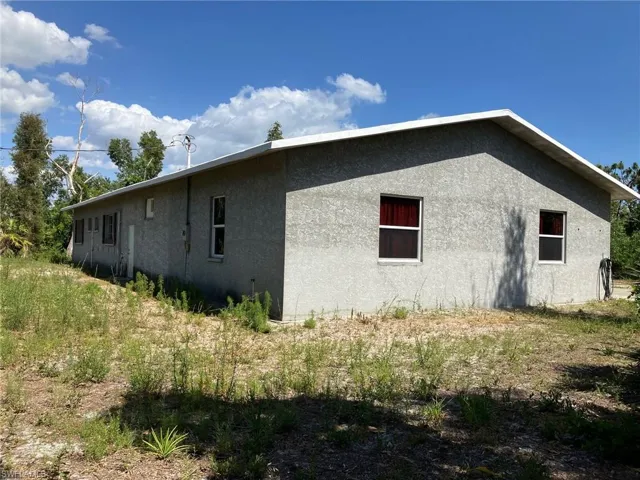 Rearview of home.  Plenty of room for a pool, deck, firepit, etc.