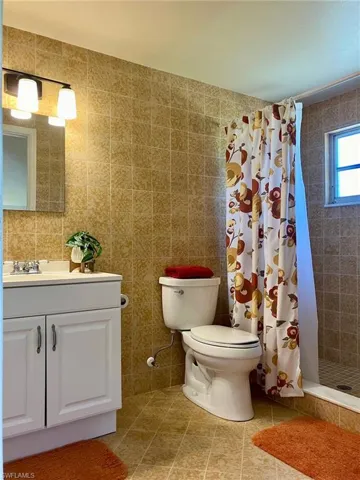 The primary bath is larger than it appears in this photo and could easily accommodate a double vanity. Concrete tile from Germany.