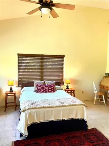 The primary bedroom is light filled and airy with very high ceilings.