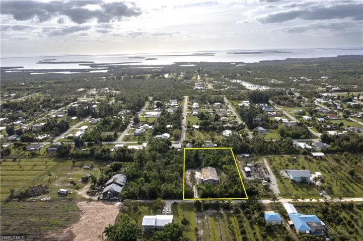 Looking West.  Vacant lot to left is also for sale, MLS#224040093.  Roof has been repaired since this photo was taken.