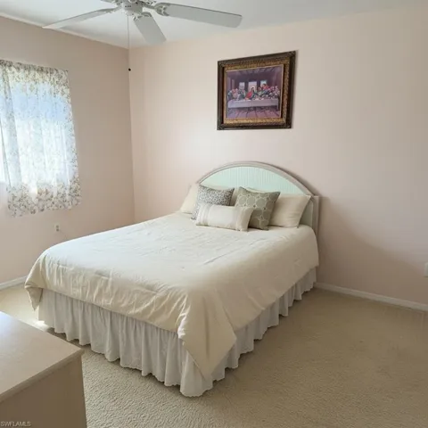 Primary bedroom with private bathroom and walk-in closet