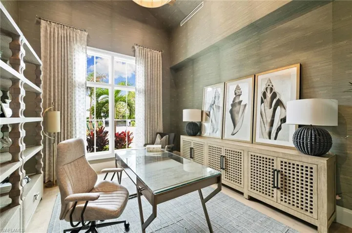 Office featuring vaulted ceiling and unique inviting design