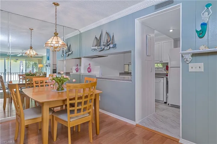 Open dining area connects seamlessly to the kitchen through a convenient pass-through, creating an easy flow for serving and entertaining.