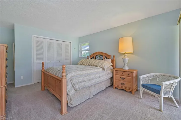 Spacious primary suite with plenty of room to relax, and soft natural light.  Generous closet storage, private bathroom and private lanai