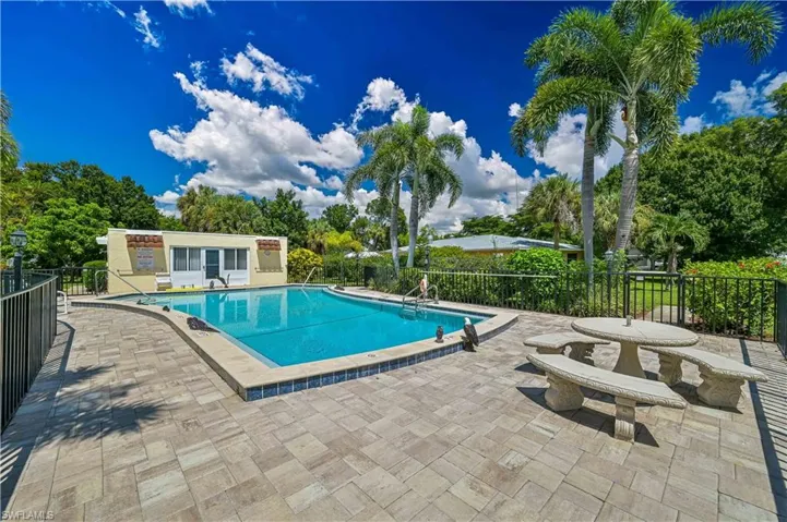Enjoy the sparkling community pool surrounded by tropical landscaping and swaying palms—the perfect place to relax and soak up the Florida sunshine.
