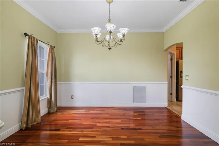 Carpeted office space featuring baseboards and ceiling fan