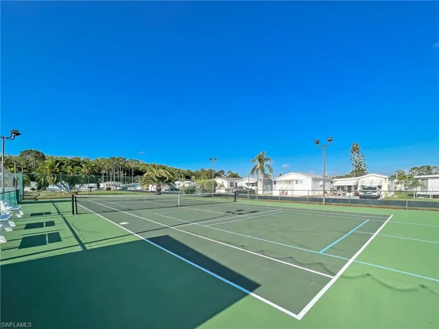 View of sport court featuring community basketball court and fence