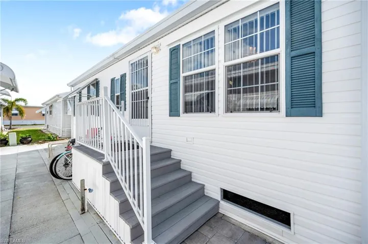 Doorway to property featuring a patio
