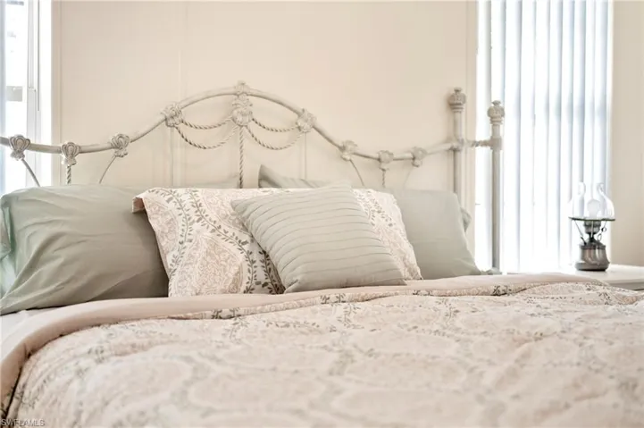 Bedroom with multiple windows
