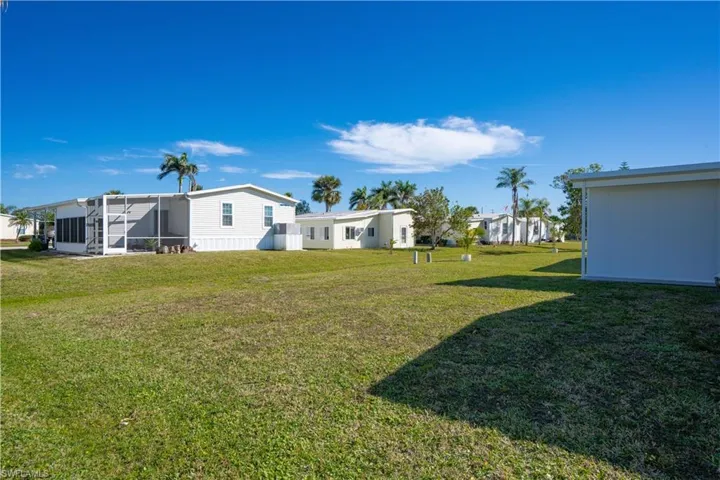 View of yard with a sunroom