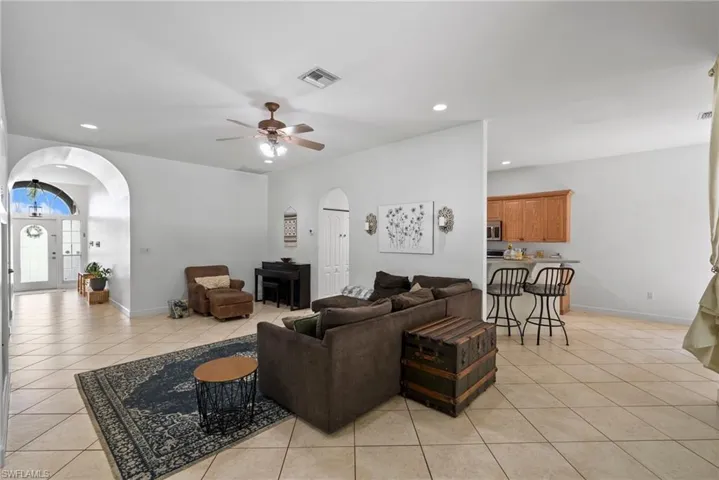 Tiled living room with ceiling fan