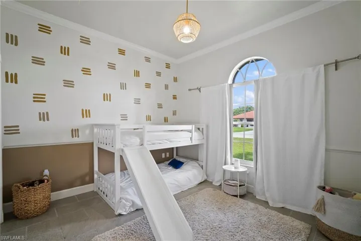 Tiled bedroom with crown molding